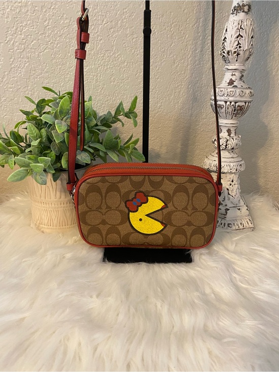 Coach Handbags - Coach Brown Signature Canvas Crossbody with Red Trim and Miss Pac-Man Graphic